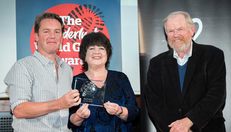 Alex receiving Top Uk Tour Guide award from Bill Bryson at the Wanderlust World tour guide awards