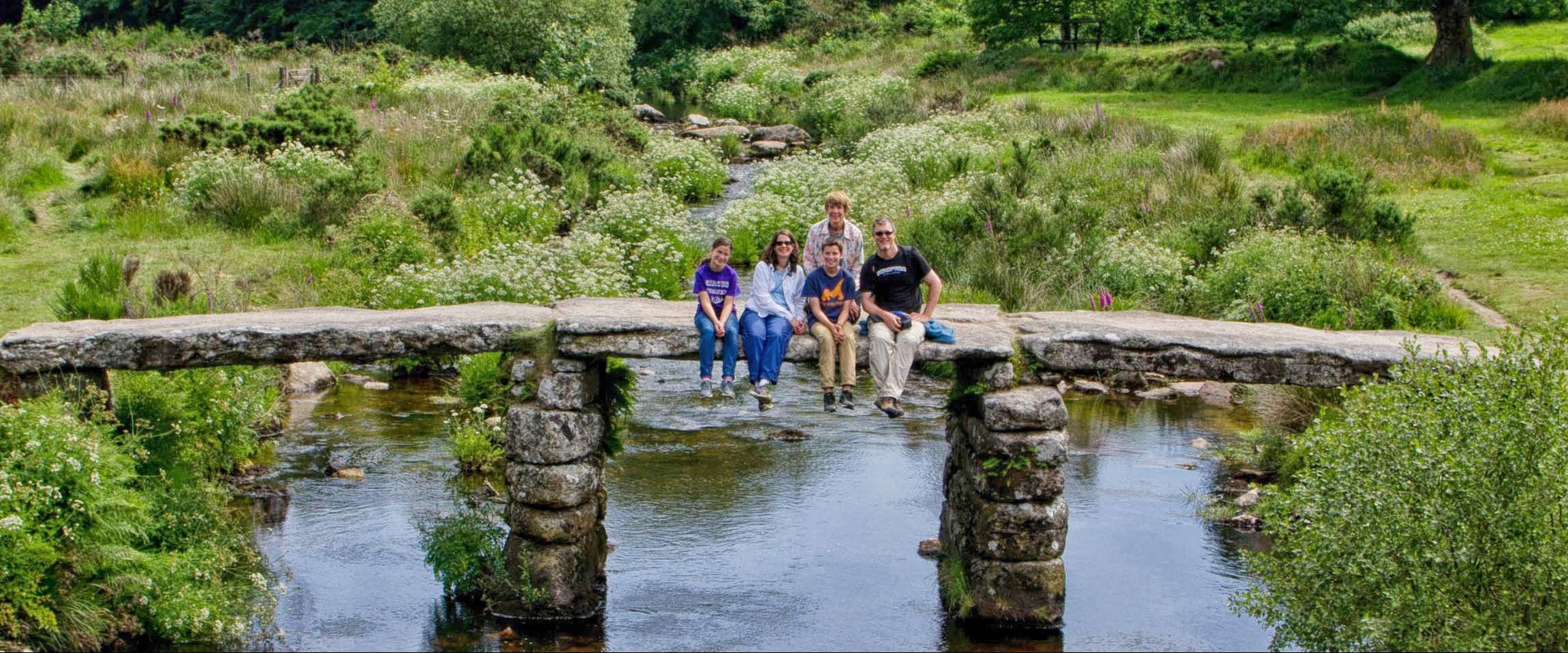 Guests on the clapper bridge at Postbridge