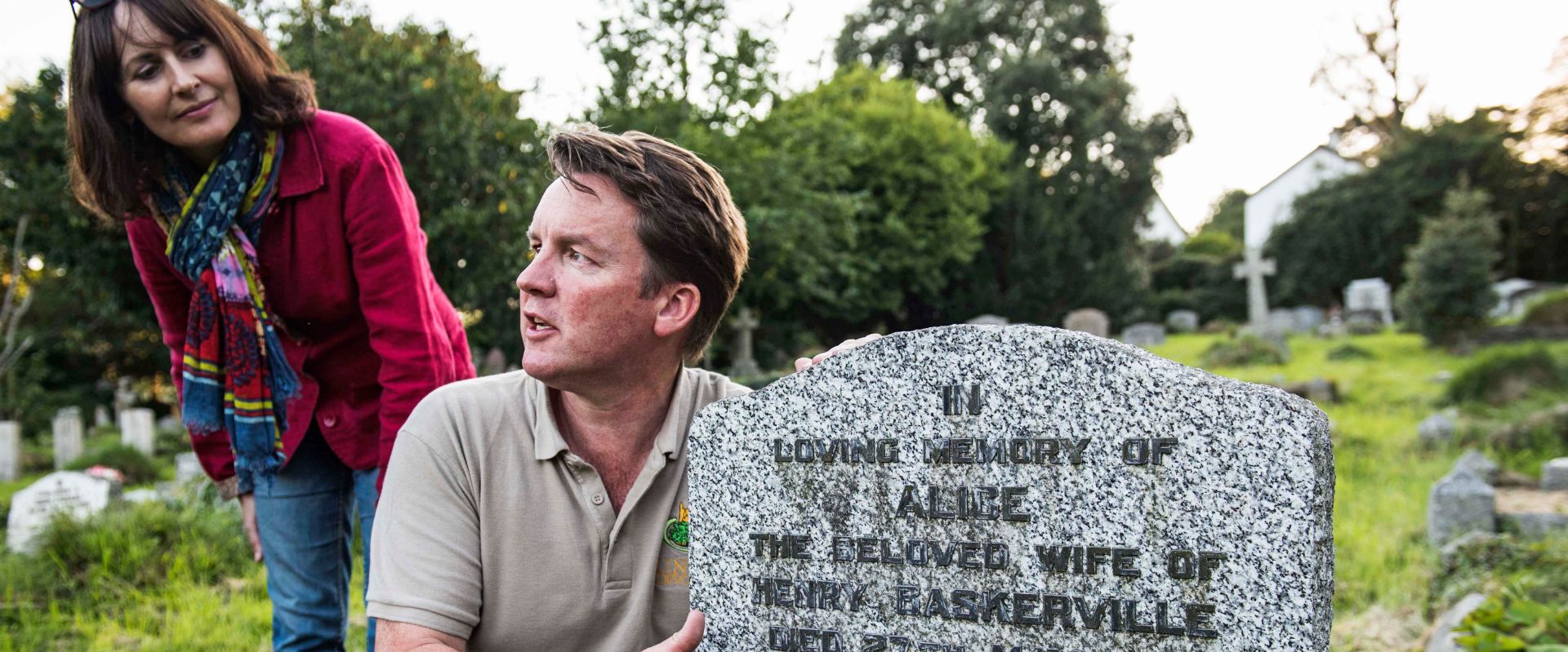 Tour guide Alex Graeme at the grave of Henry Baskerville