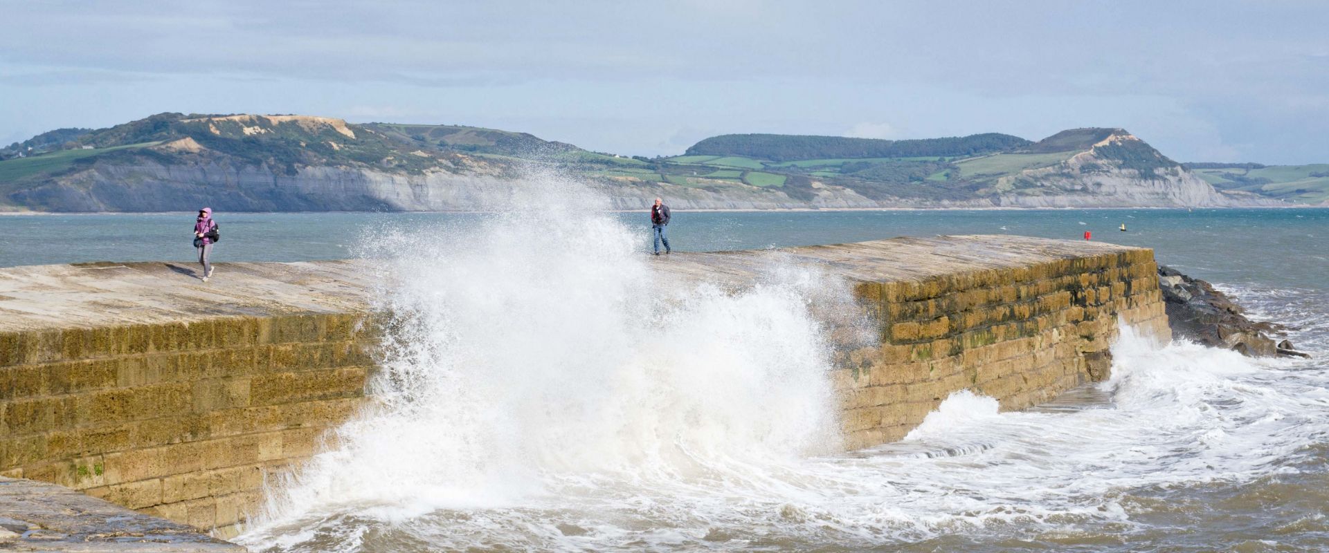 The Cobb at Lyme Regis being hit by winter storms